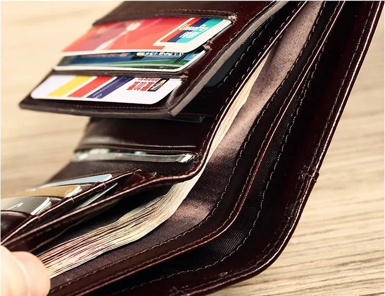 Men's leather wallet open showing photo holder, card slots, banknote folder, and hidden zippered compartment.