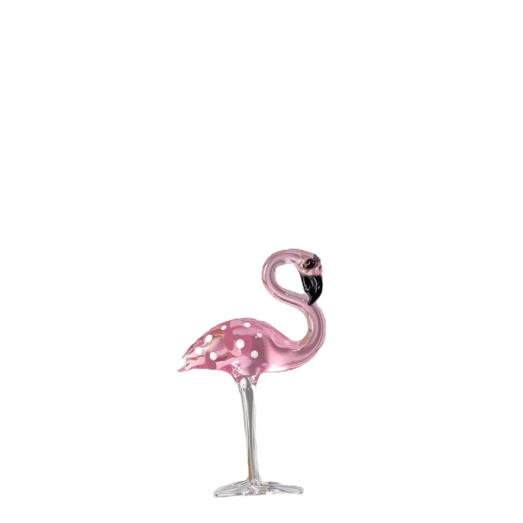 Pink and white crystal decorative flamingo table prop on a modern shelf