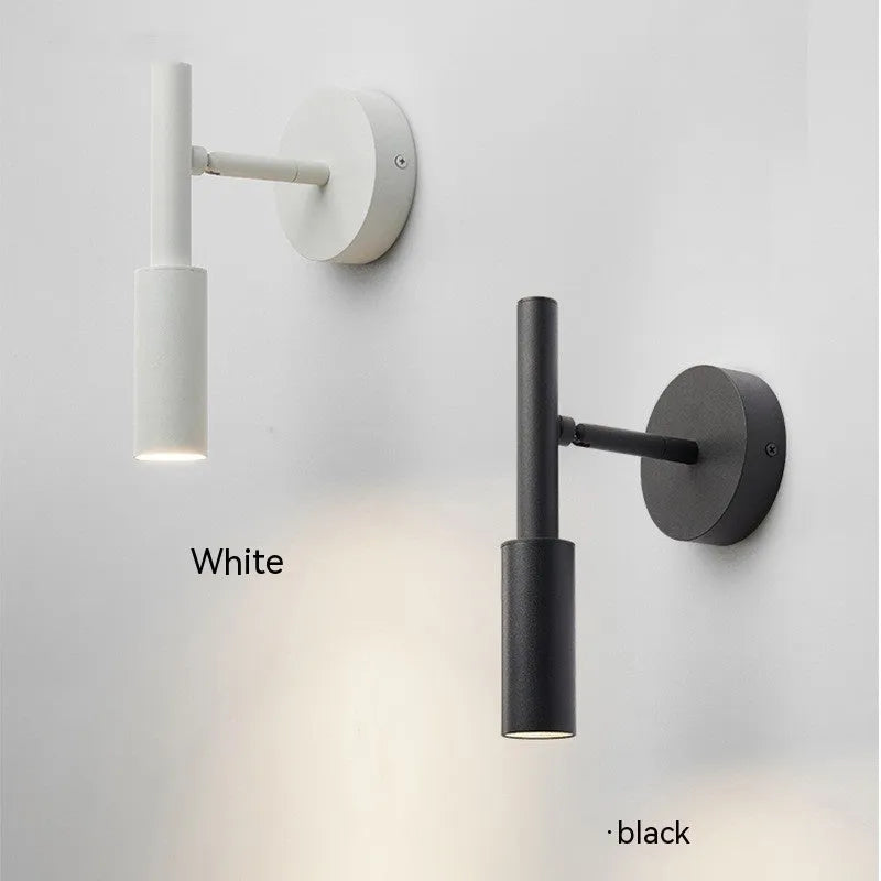 Modern cylindrical wrought iron wall lamp in black or white with three colour light settings.