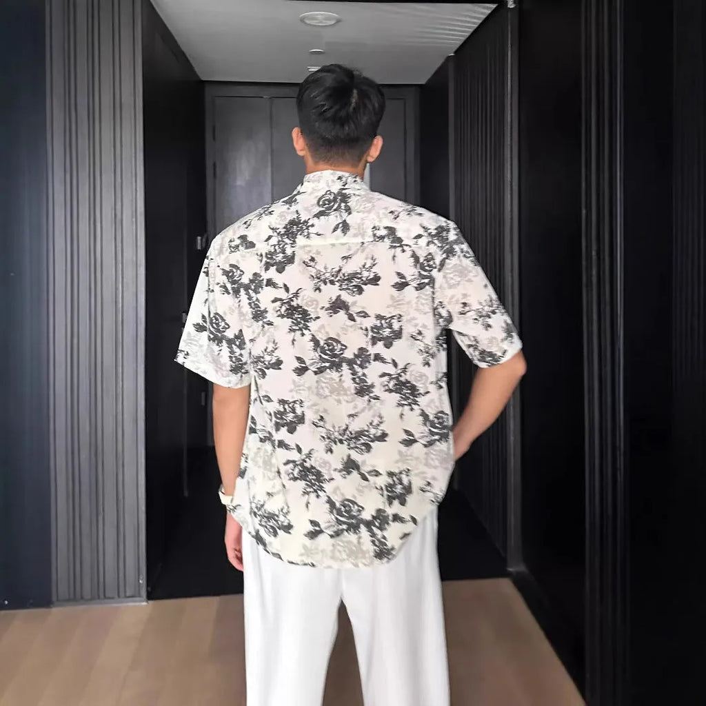 White floral printed casual shirt with short sleeves and loose cardigan-style fit