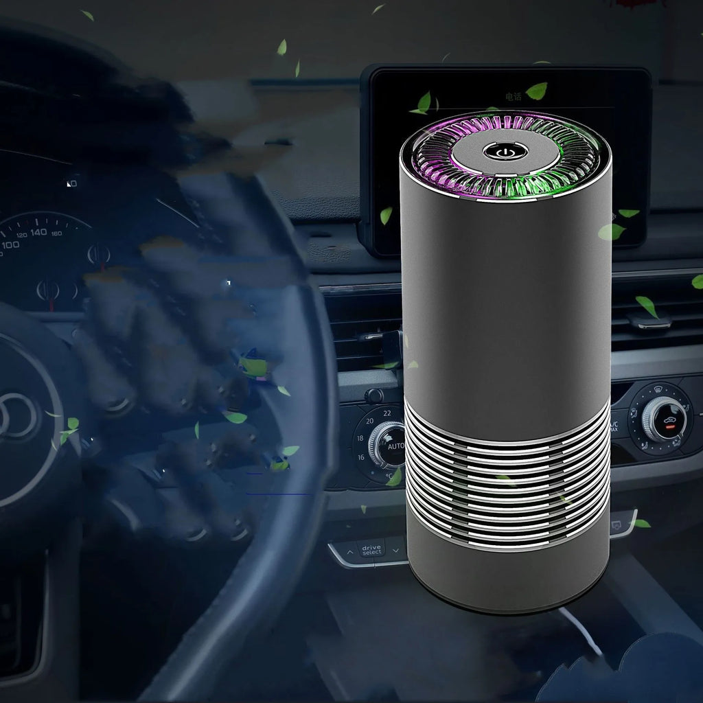 Compact black car air purifier with aluminium alloy body, shown with power cord.