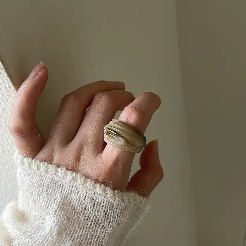 Chinese style irregular geometric resin ring with wide band design in Maillard brown colour