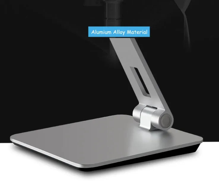 Silver foldable aluminium tablet phone holder showing 360-degree rotation mechanism and silicone anti-slip pads