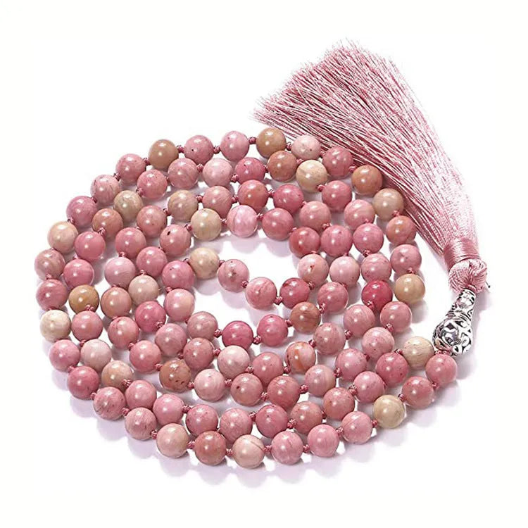 Long beaded agate necklace with geometric stones and a tassel, showing colourful variations.