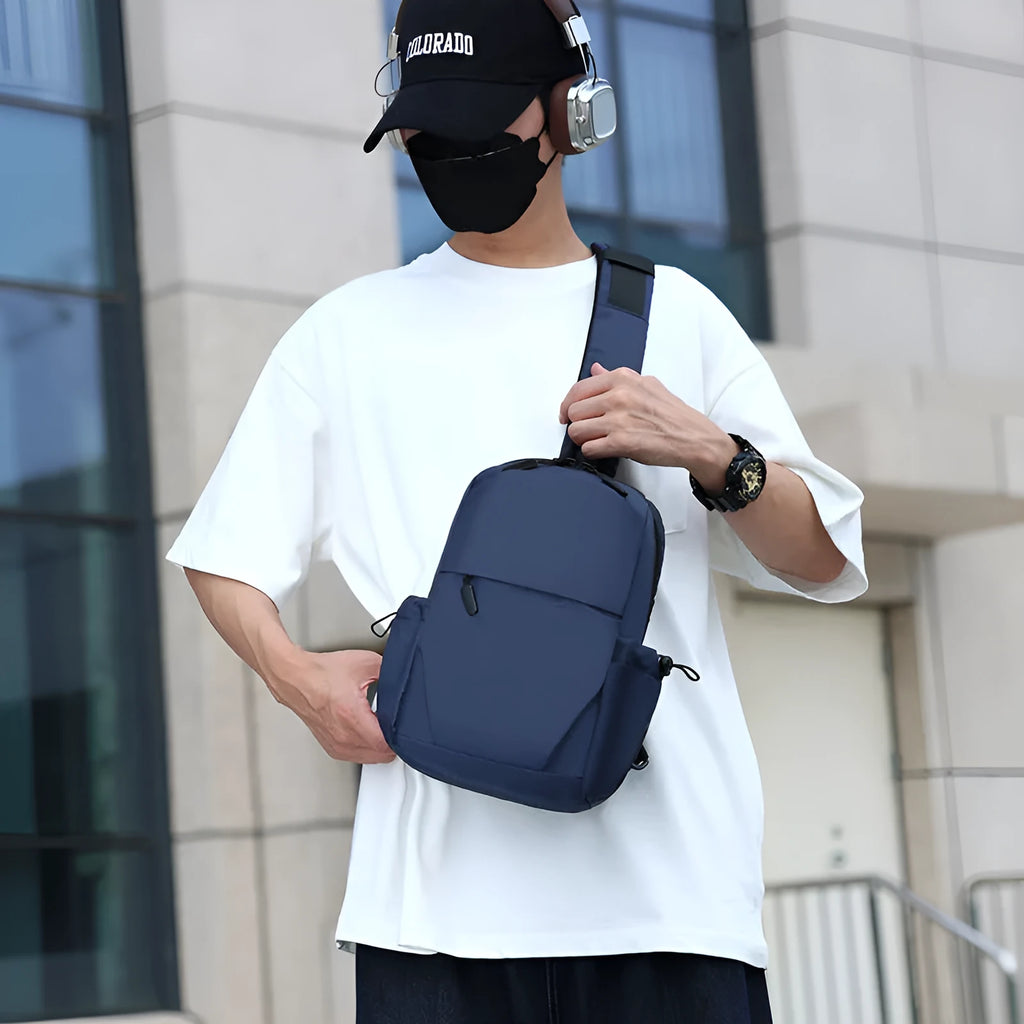 Men's grey lightweight chest bag showing shoulder strap and front compartment