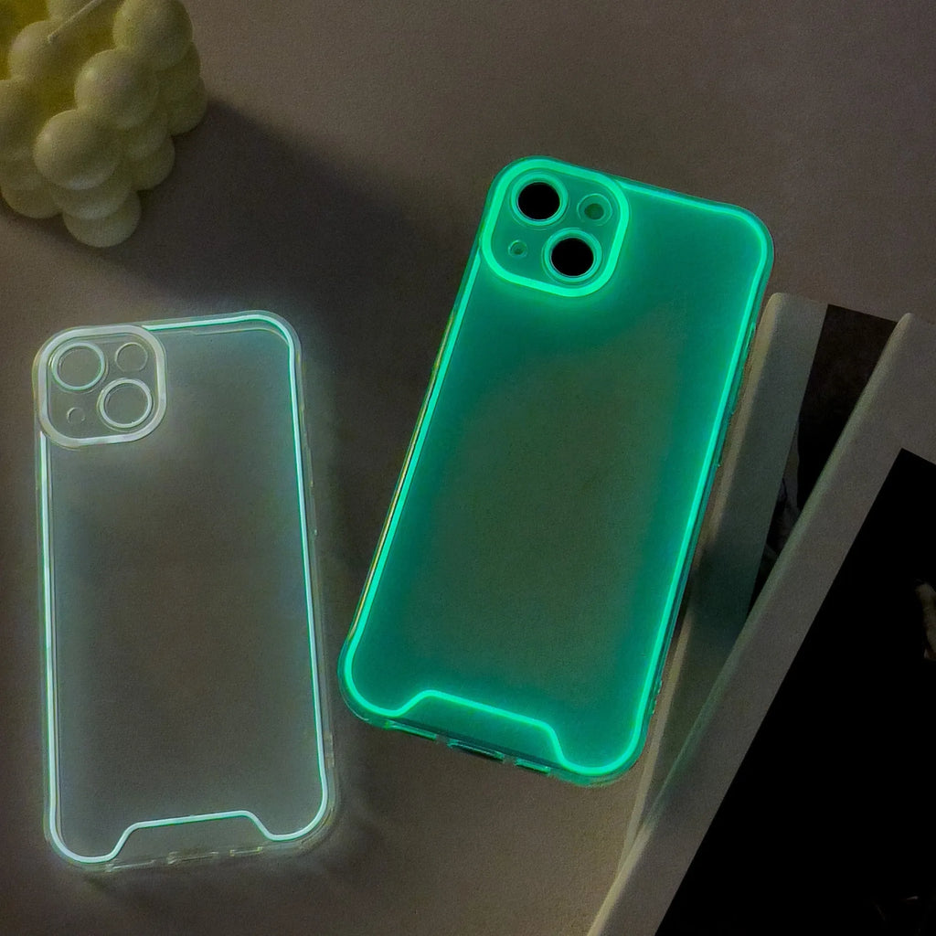 Glow in the dark green Christmas soft shell iPhone case on a table.