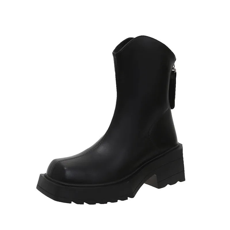 Women's black platform Martin boots with square toe, chunky heel, and back zipper on a plain background