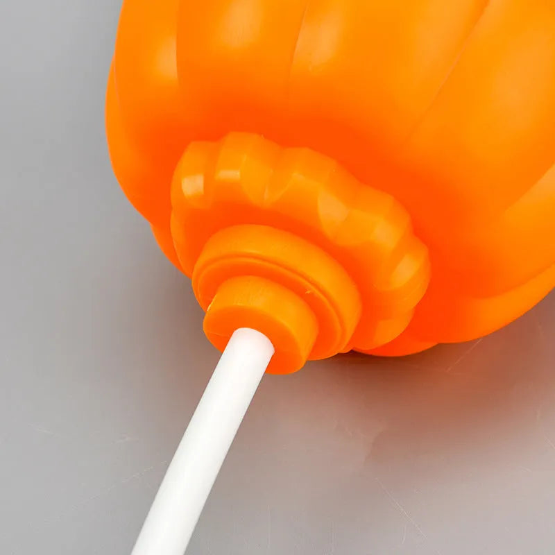 Plastic pumpkin lamp with USB charging cable in purple or yellow light colour