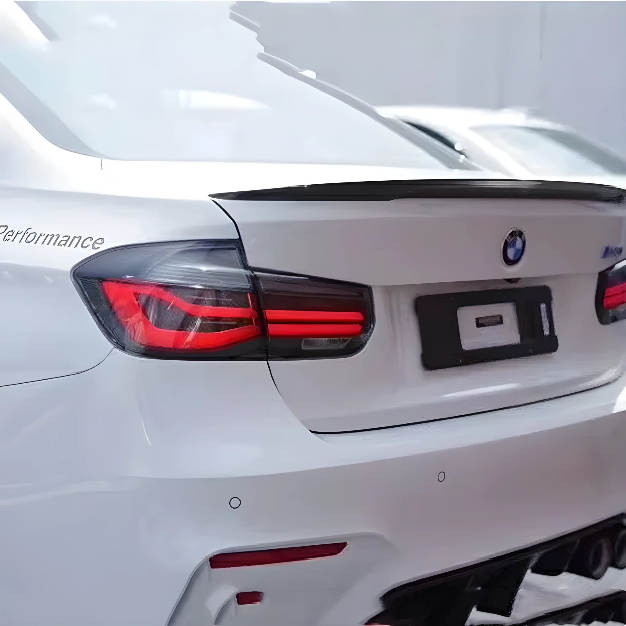 BMW 3 Series red and black smoke LED tail light assembly with streamer steering design.