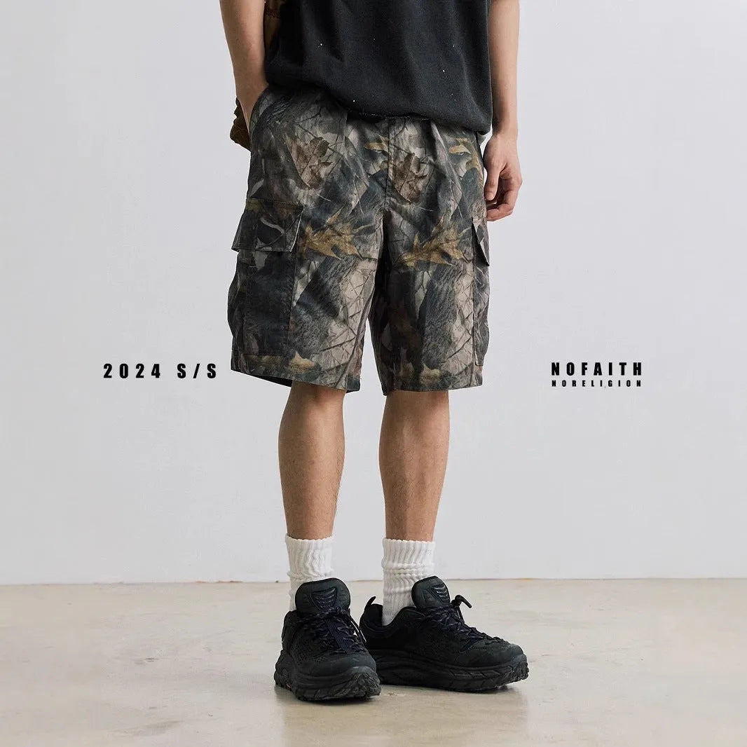 Loose fit straight-leg denim shorts in black shown on a hanger.