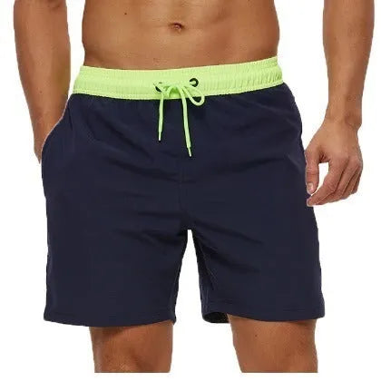 Men's blue drawstring shorts with stitched waistband and zippered pockets, shown for running and fitness use.