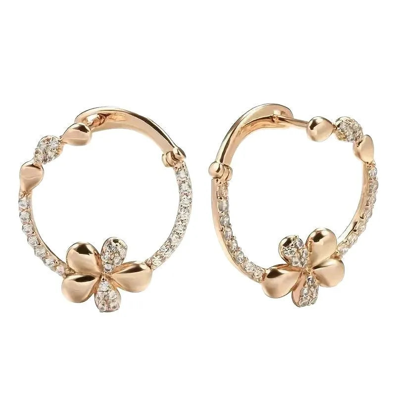 A pair of round copper hoop earrings for women with an electroplated finish.