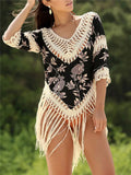 Women's apricot coloured V-neck sun protection shirt with hollow-out sleeves for beachwear.