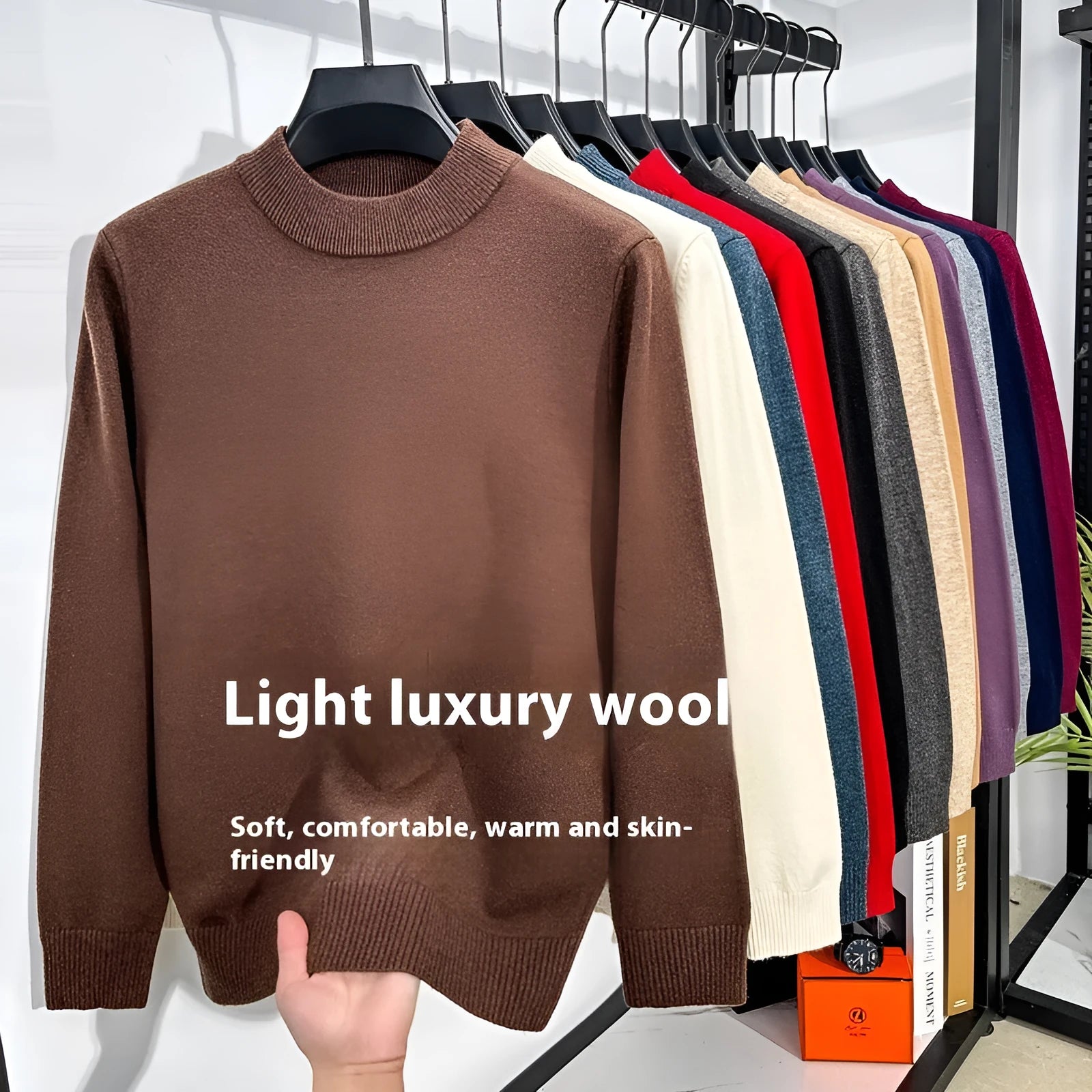 Men's solid colour half turtleneck long sleeve pullover sweater on a hanger.