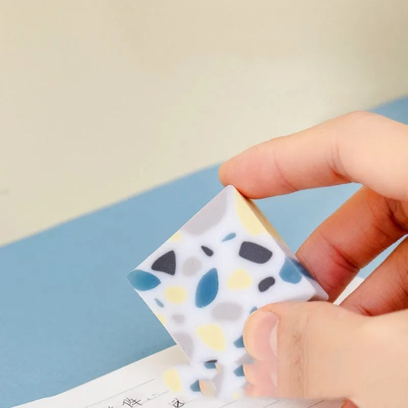 Super Clean Traceless brick design rubber eraser on a white background.