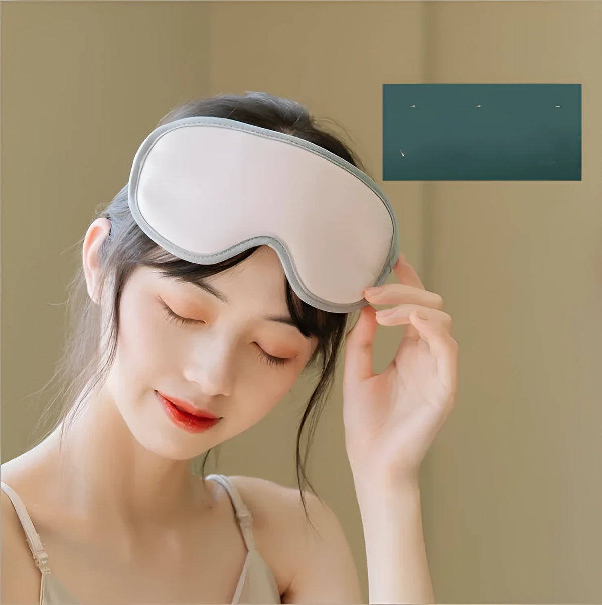Green portable eye massage goggles showing USB connection and suede exterior