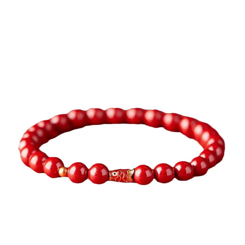 Traditional Chinese cinnabar koi bracelet with natural raw ore materials and golden ball design in 4mm or 6mm sizes