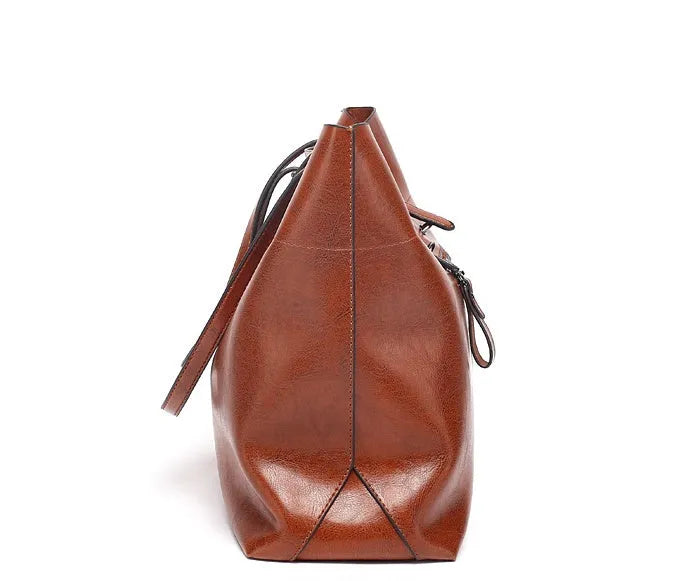 Waxed cowhide leather handbag showing horizontal cross-section opening and internal compartments