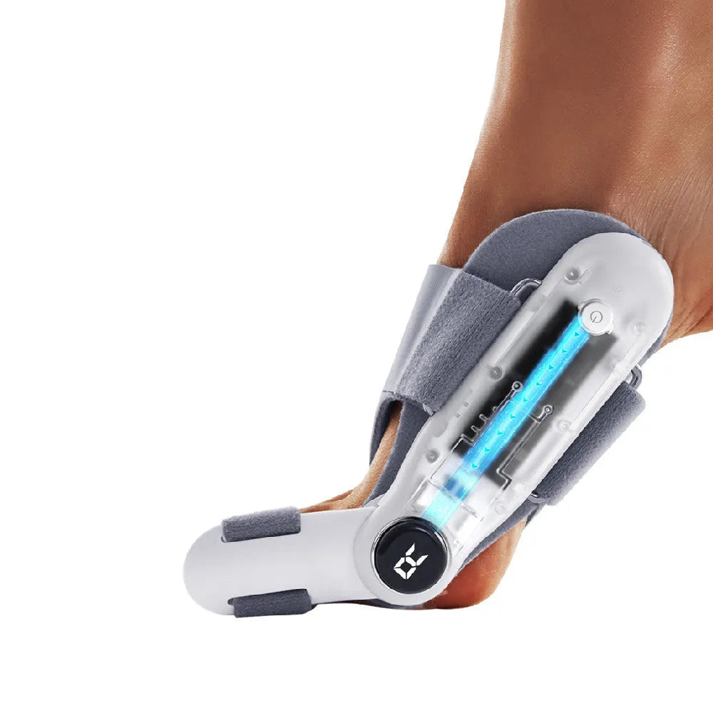 White plastic electric hallux valgus toe separator with adjustment controls and a USB Type-C charging port.