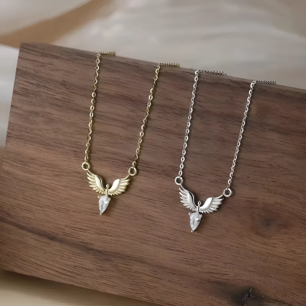 Women's silver eagle pendant necklace with adjustable O-ring chain in white gold or yellow gold finish