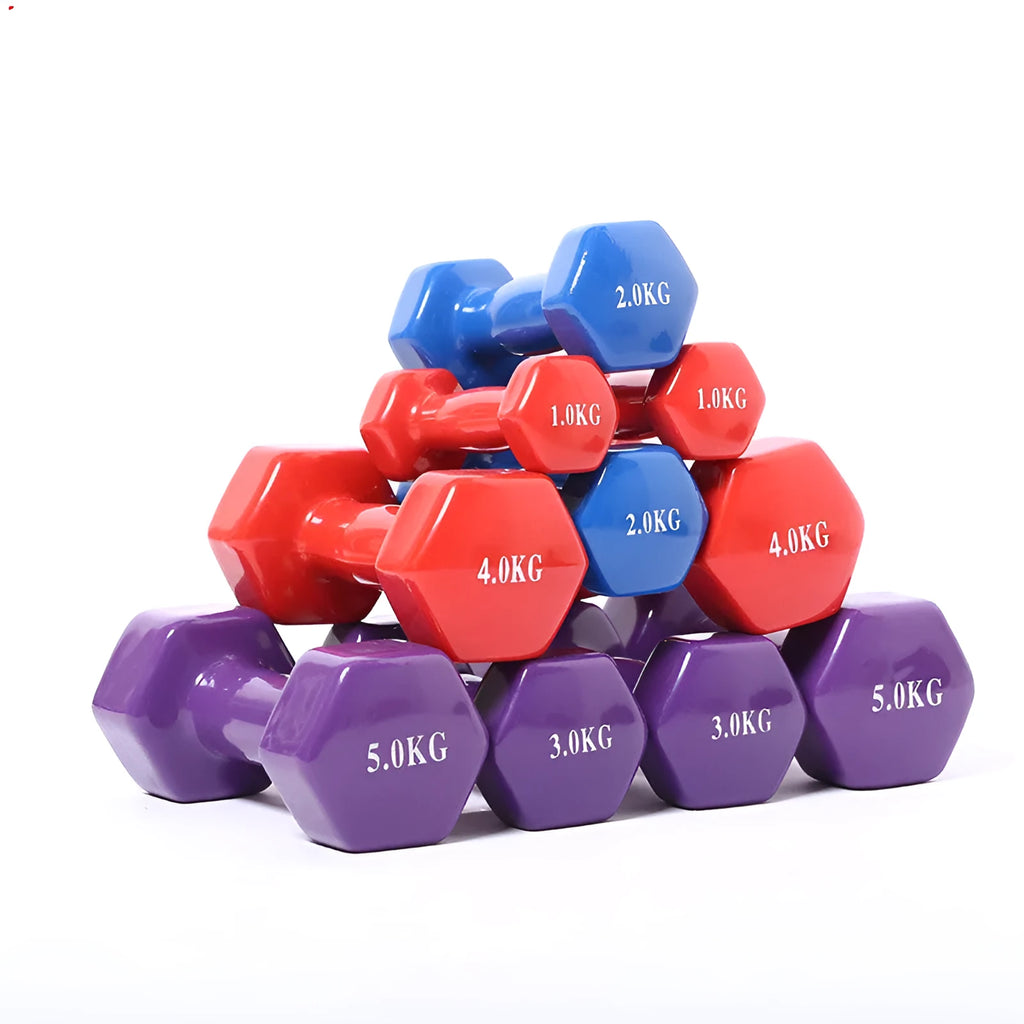 Set of bright green and purple plastic dumbbells on a wooden floor.