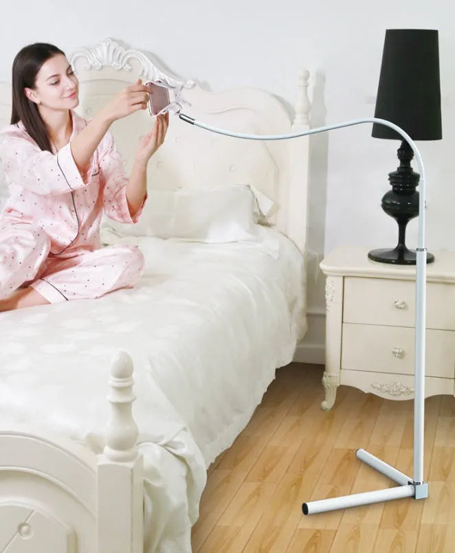 Black mobile phone bed bracket with overhead shelf mounted beside bed for hands-free viewing