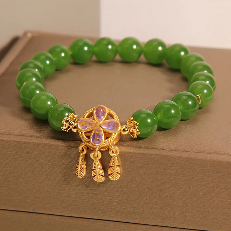 Green jasper crystal bracelet with four-leaf clover dream catcher pendant for women.