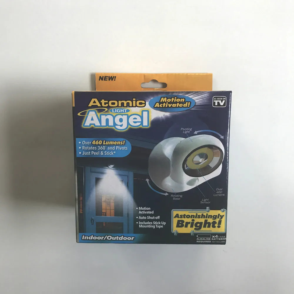 White Atomic Angel induction LED night light with touch sensor on front.