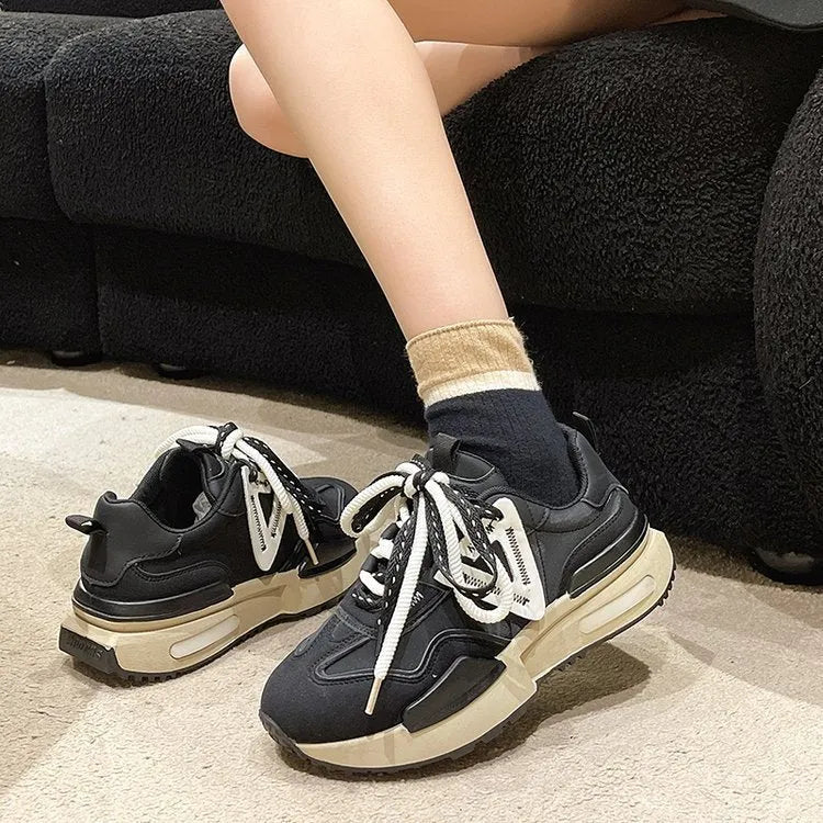 Women's black retro platform sports shoes with a round toe and lace-up front.