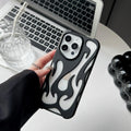 Electroplated hollow flame pattern iPhone case in silver TPU soft shell on a mobile phone.