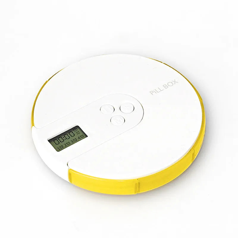 Blue 7-compartment alarm clock pill dispenser showing timer display and weekly medicine slots