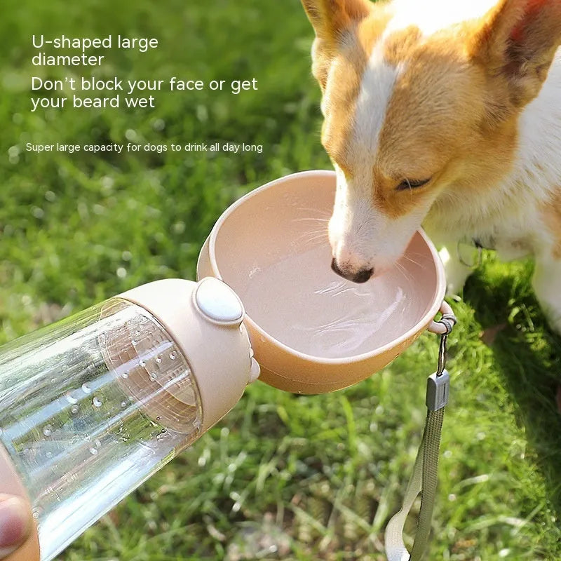 Portable dog water bottle and food container in brown, pink and yellow colours with included dog cup