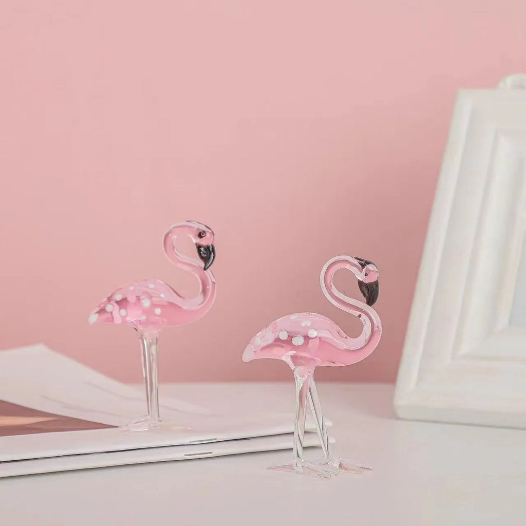 Pink and white crystal decorative flamingo table prop on a modern shelf