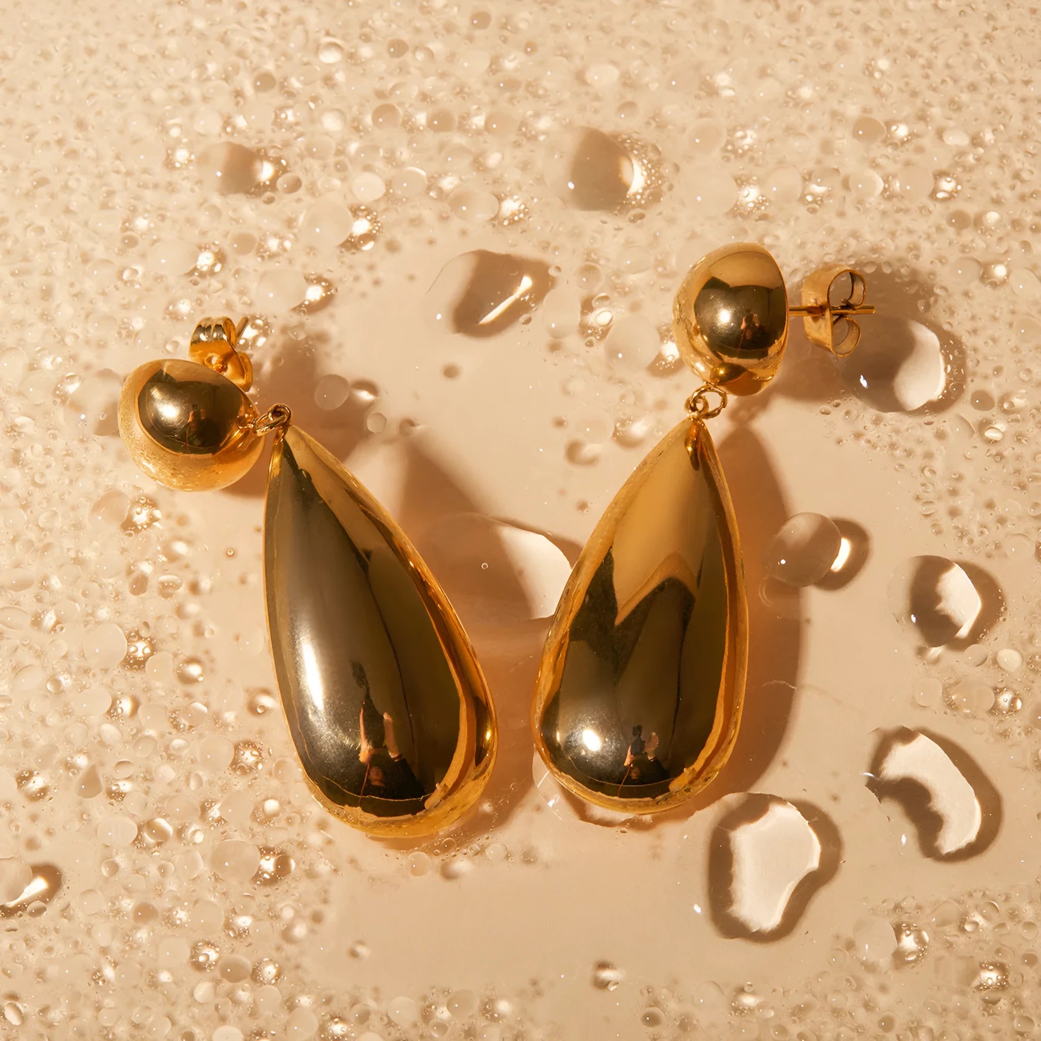 Gold stainless steel hemisphere water drop pendant earrings with electroplated finish for women