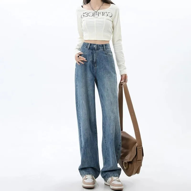 Woman wearing retro blue high waist wide leg jeans with a straight leg cut.