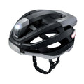 Black and grey smart cycling helmet with integrated warning lights showing USB charging port