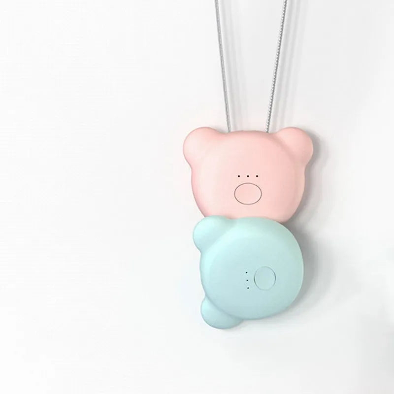 Mini USB air purifier necklace in pink, showing compact dimensions and wearable design.