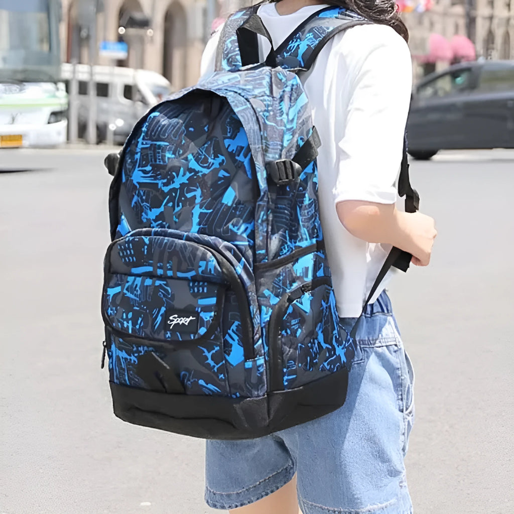 Blue nylon backpack with adjustable straps and large main compartment.