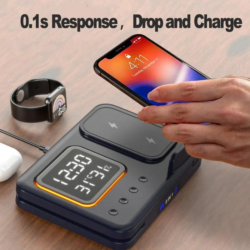 Black wireless charging station with digital clock displaying time and temperature charging phone and watch