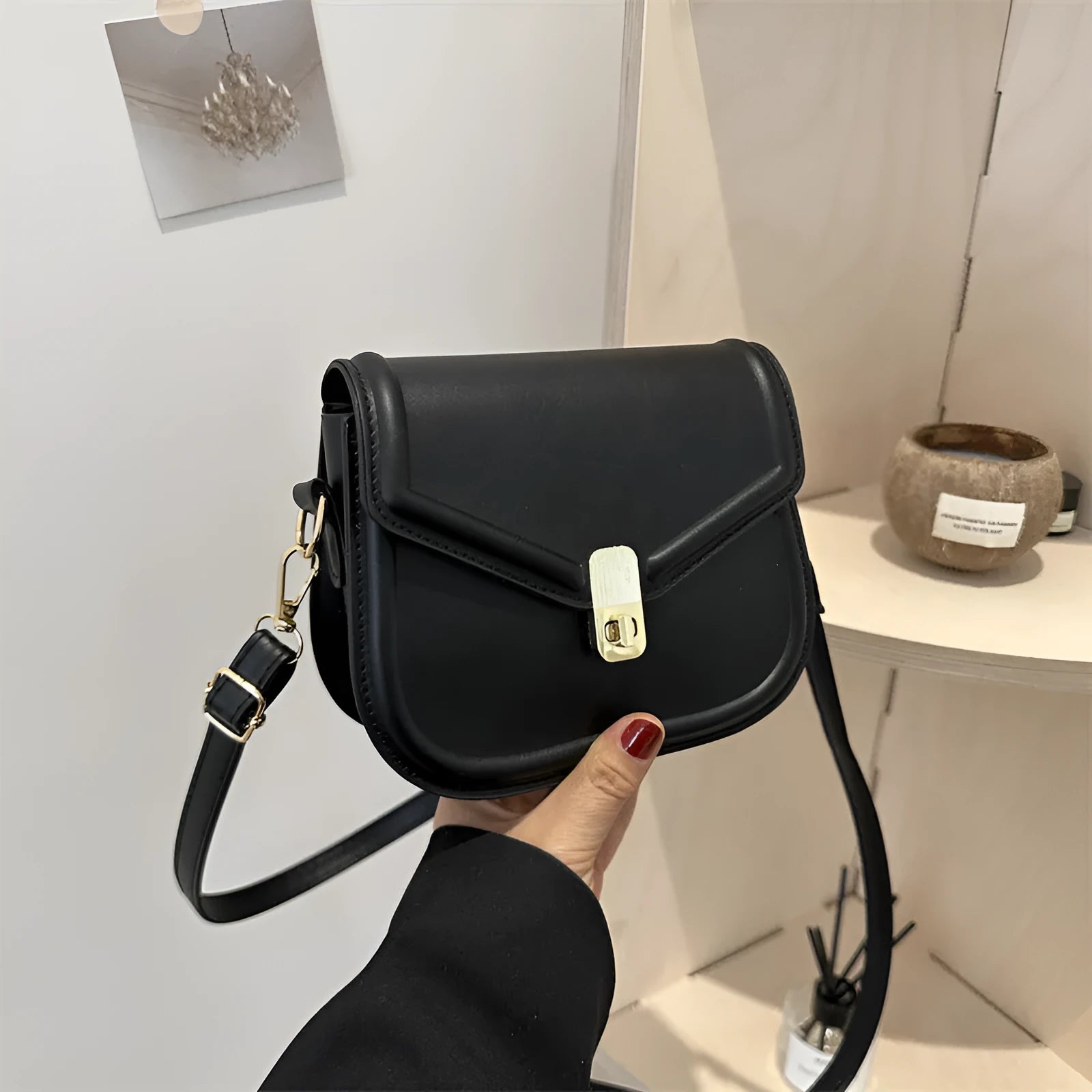 Soft PU leather clamshell shoulder messenger bag in a horizontal square shape.