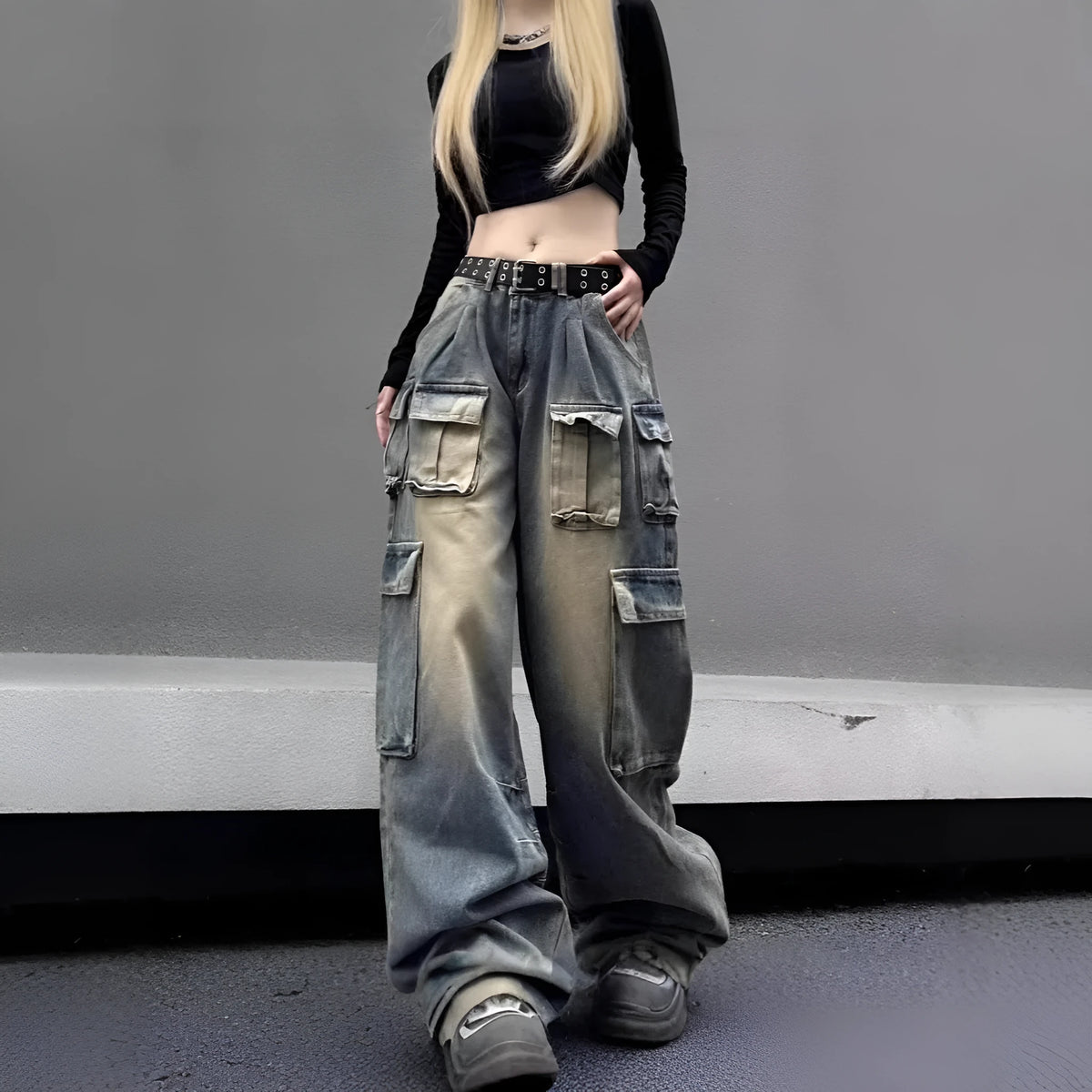 Light blue distressed denim pants with multiple pockets and straight leg loose fit