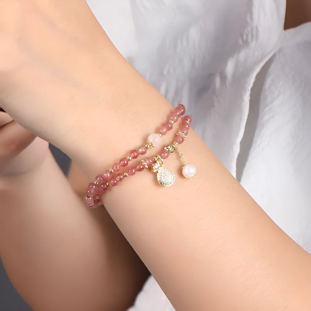 Women's strawberry quartz crystal bracelet with a geometry shape design.