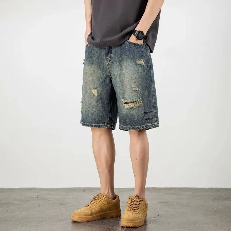 Blue men's denim shorts with a retro loose hole distressed design and a straight-leg cut