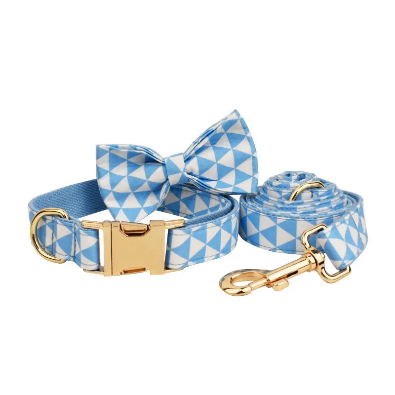 Blue triangular ring rope dog vest, collar, leash, and bow four-piece set laid out flat.