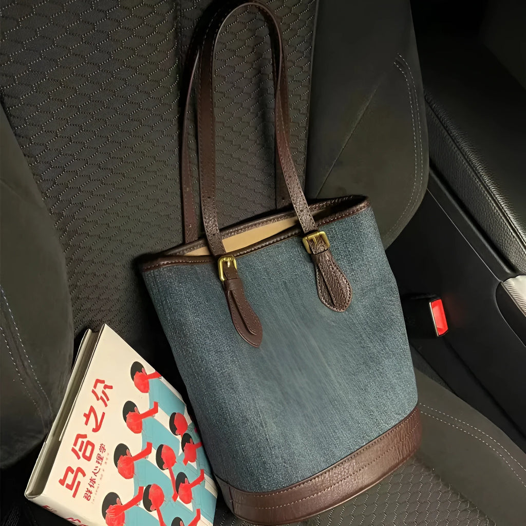 Retro denim patchwork one-shoulder bucket handbag showing large capacity interior