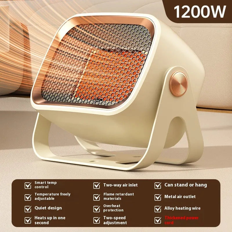 A compact grey desktop electric heater with a rotatable design on a wooden desk.