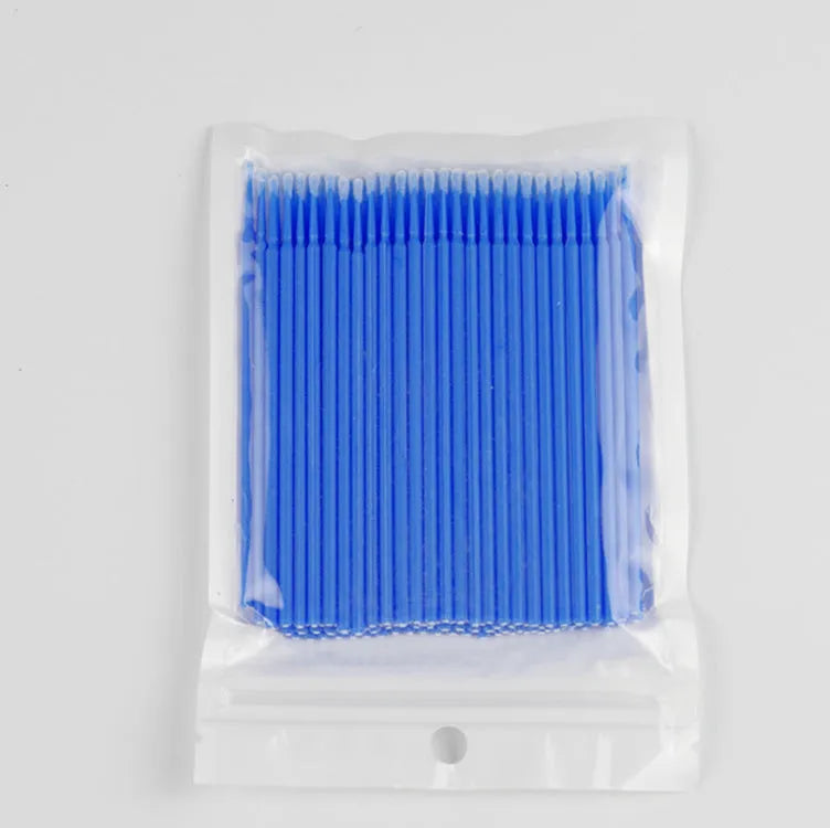 Disposable micro applicator brushes with bendable cotton tips and colour-coded handles for eyelash extensions