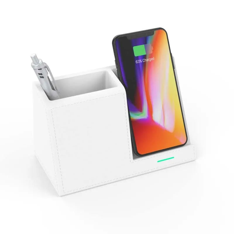 Black leather desk organiser with wireless phone charging pad and pen holder slots.