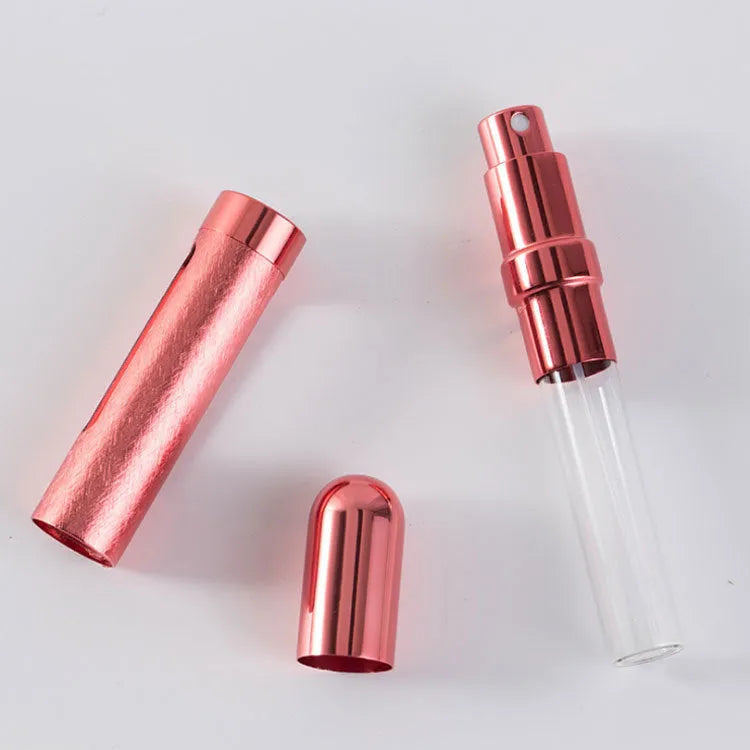 12ml aluminium portable perfume bottle in bullet shape with glass liner, shown in various colours.