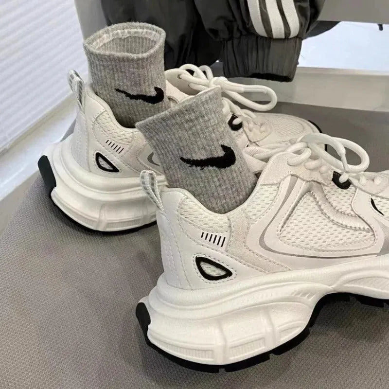 Beige Polar Wave mesh platform sports shoes with a wedge heel and lace-up front.